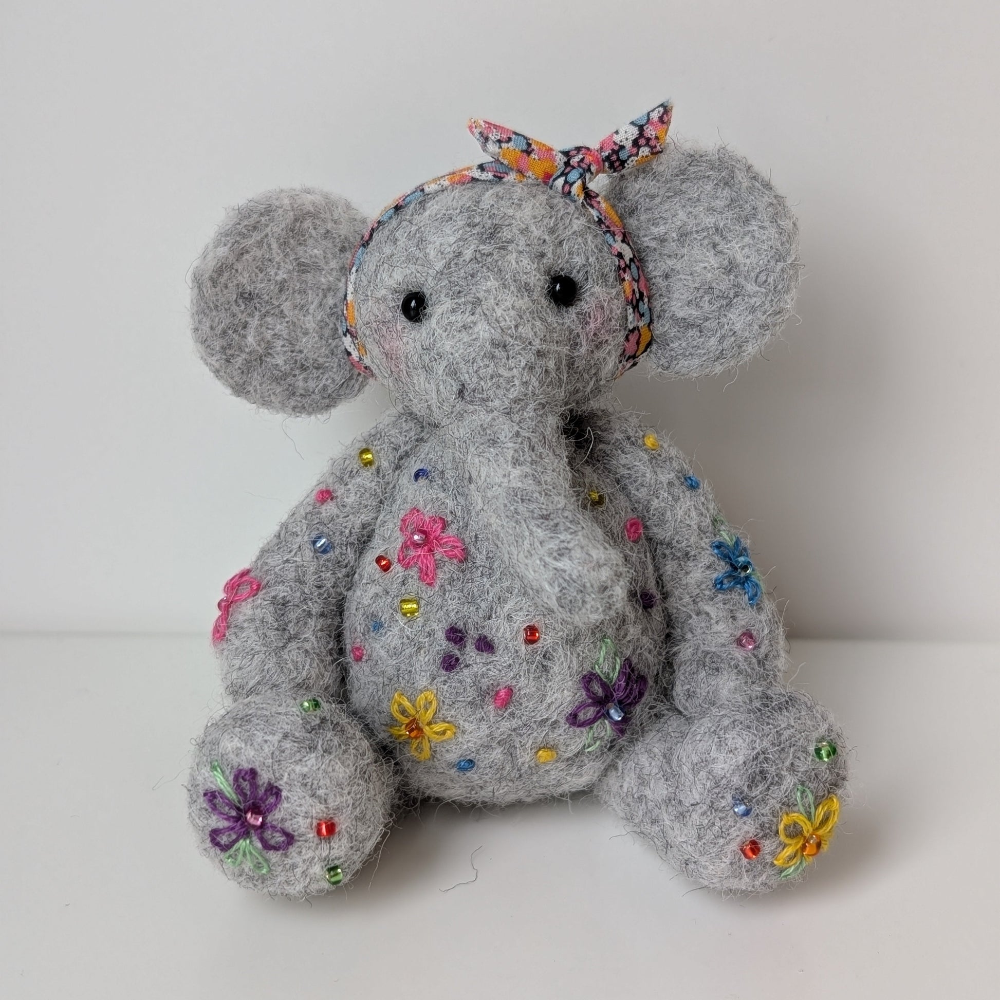 Grey needleflet elephant with floral embroidery