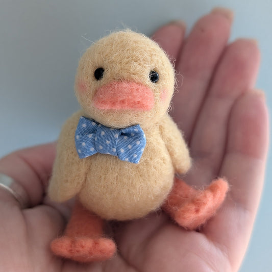 needlefelt yellow duckiling with a spotty bow tie