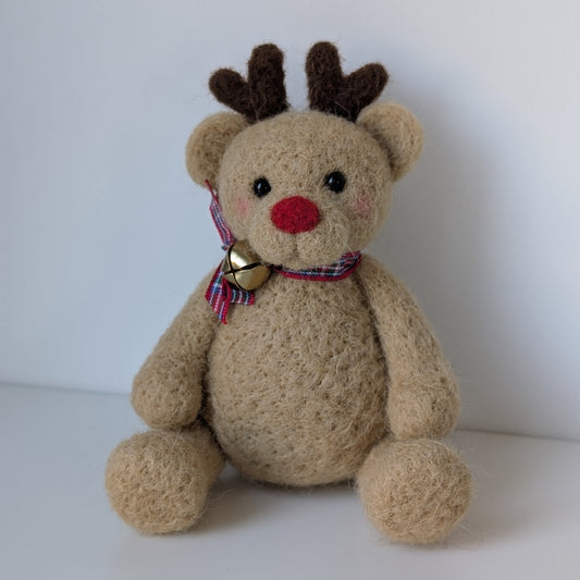 needlefelt brown bear with antlers and gold bell on a tartan bow