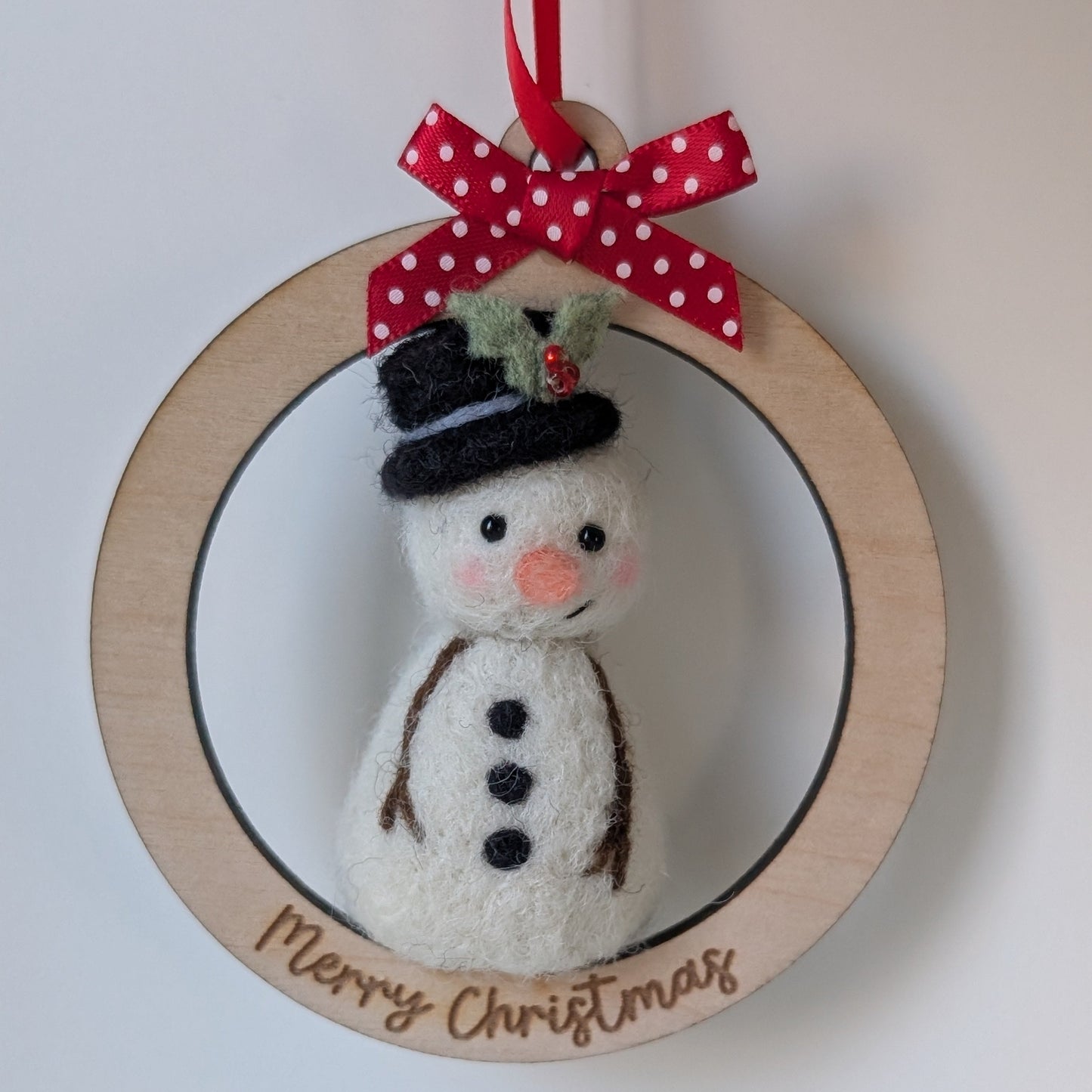 needlefelt snowman on a wooden bauble